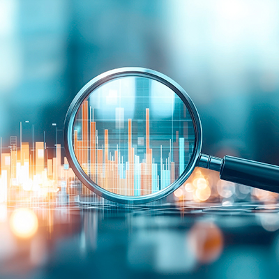 Stock photo of magnifying glass over digital analytics