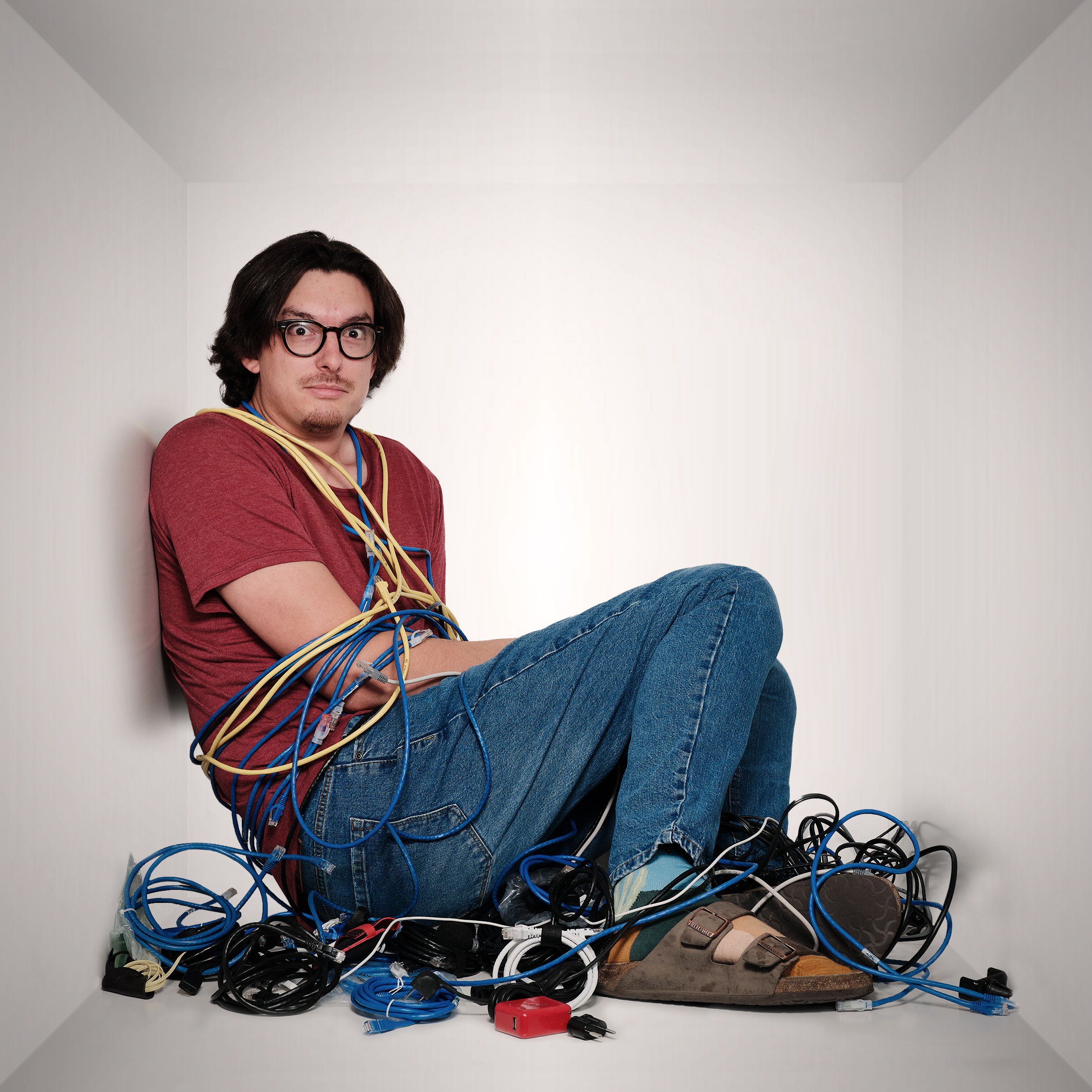 Aaron tied up in cords