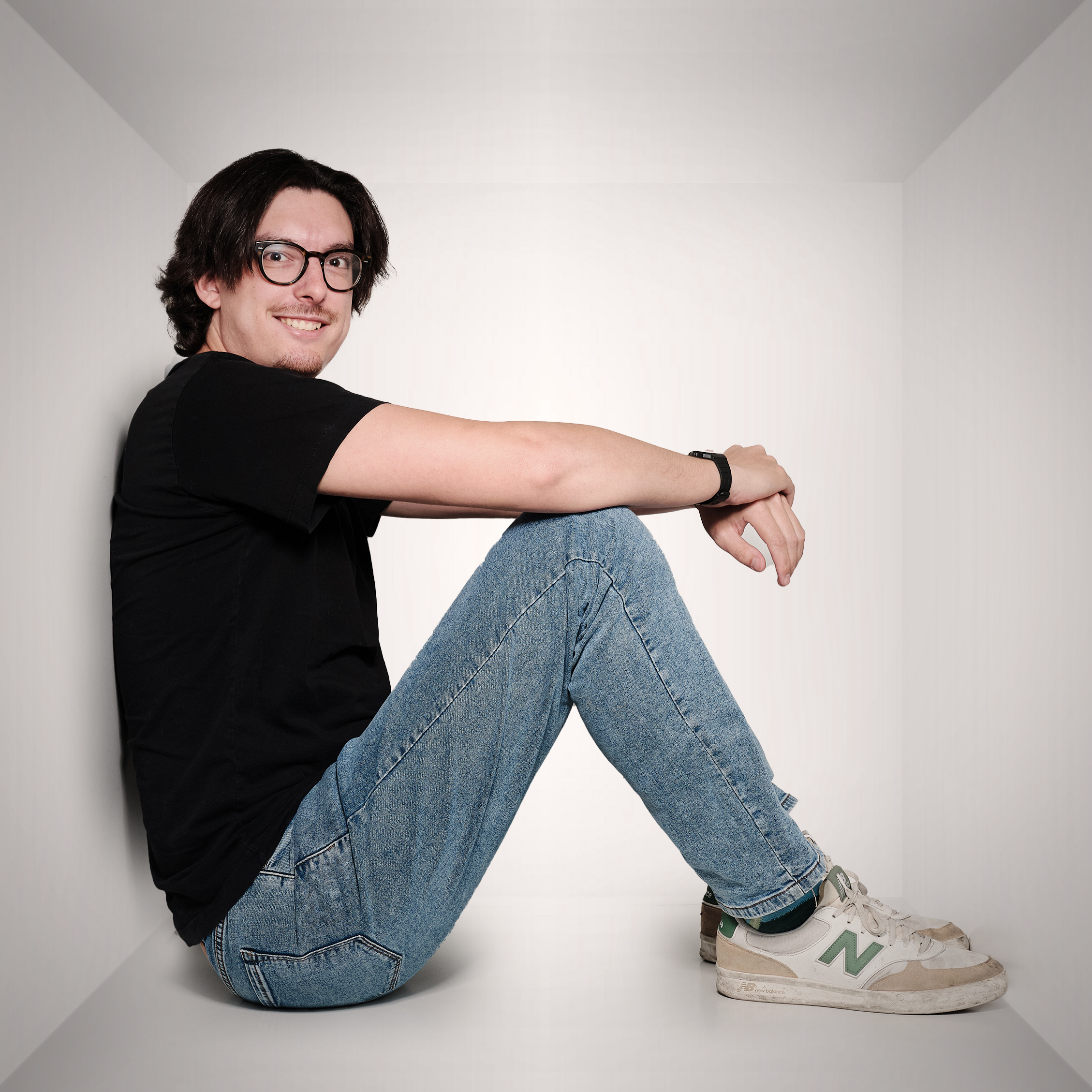 Aaron sitting and smiling