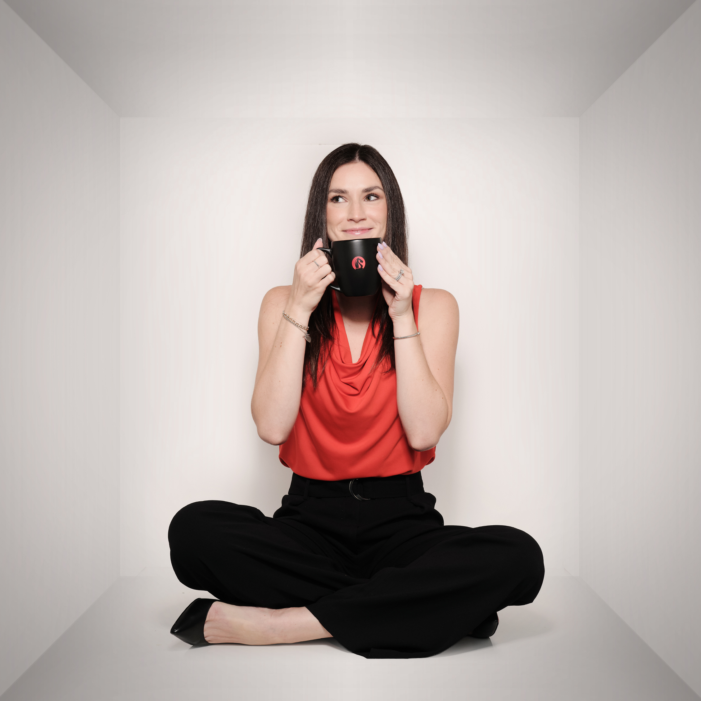 Bianca holding a coffee mug