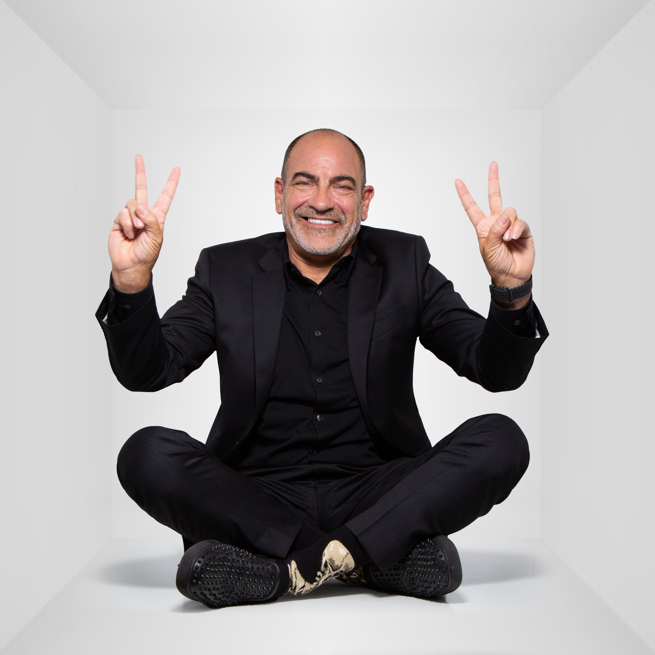 Brian throwing up double peace signs