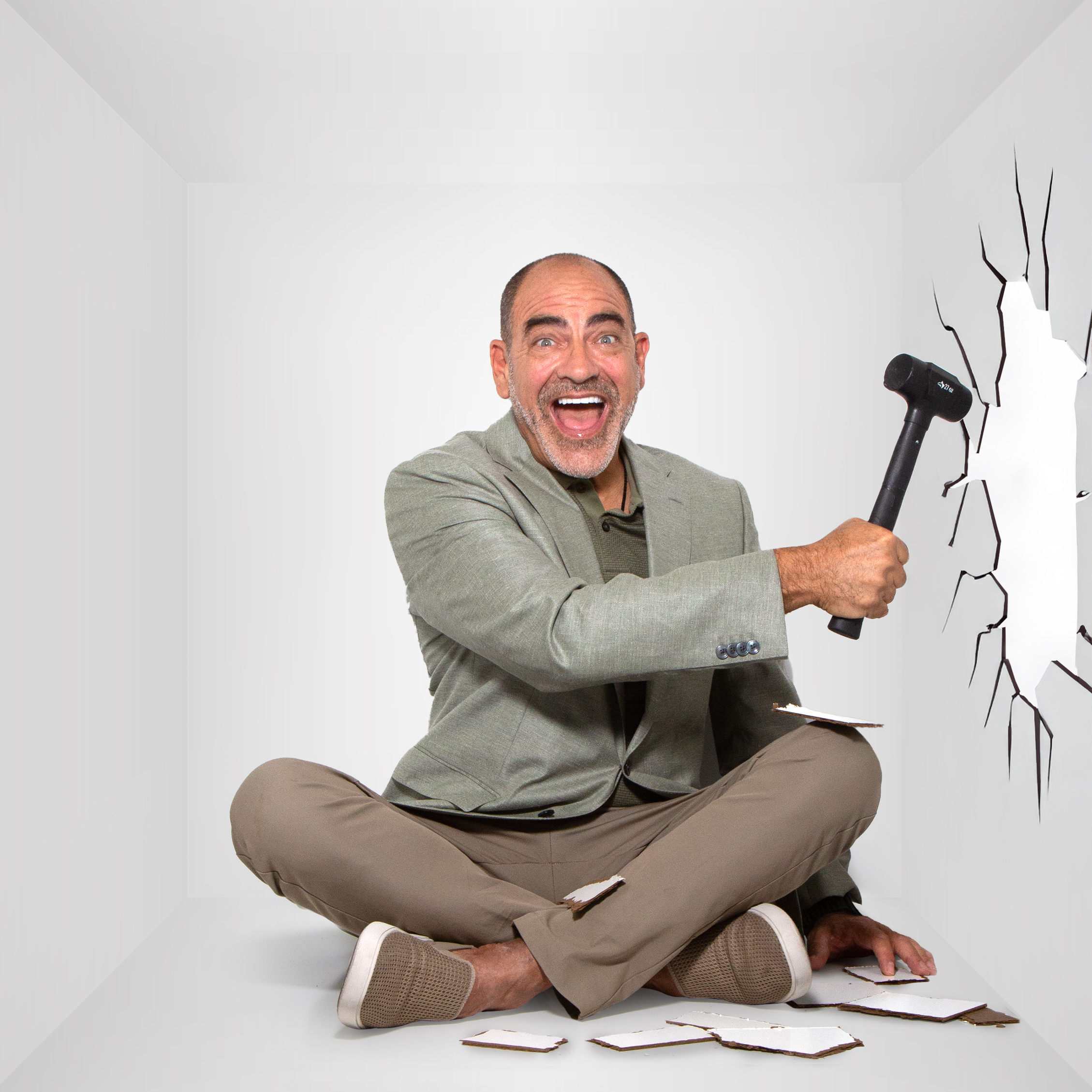 Brian breaking the side of the box with a hammer