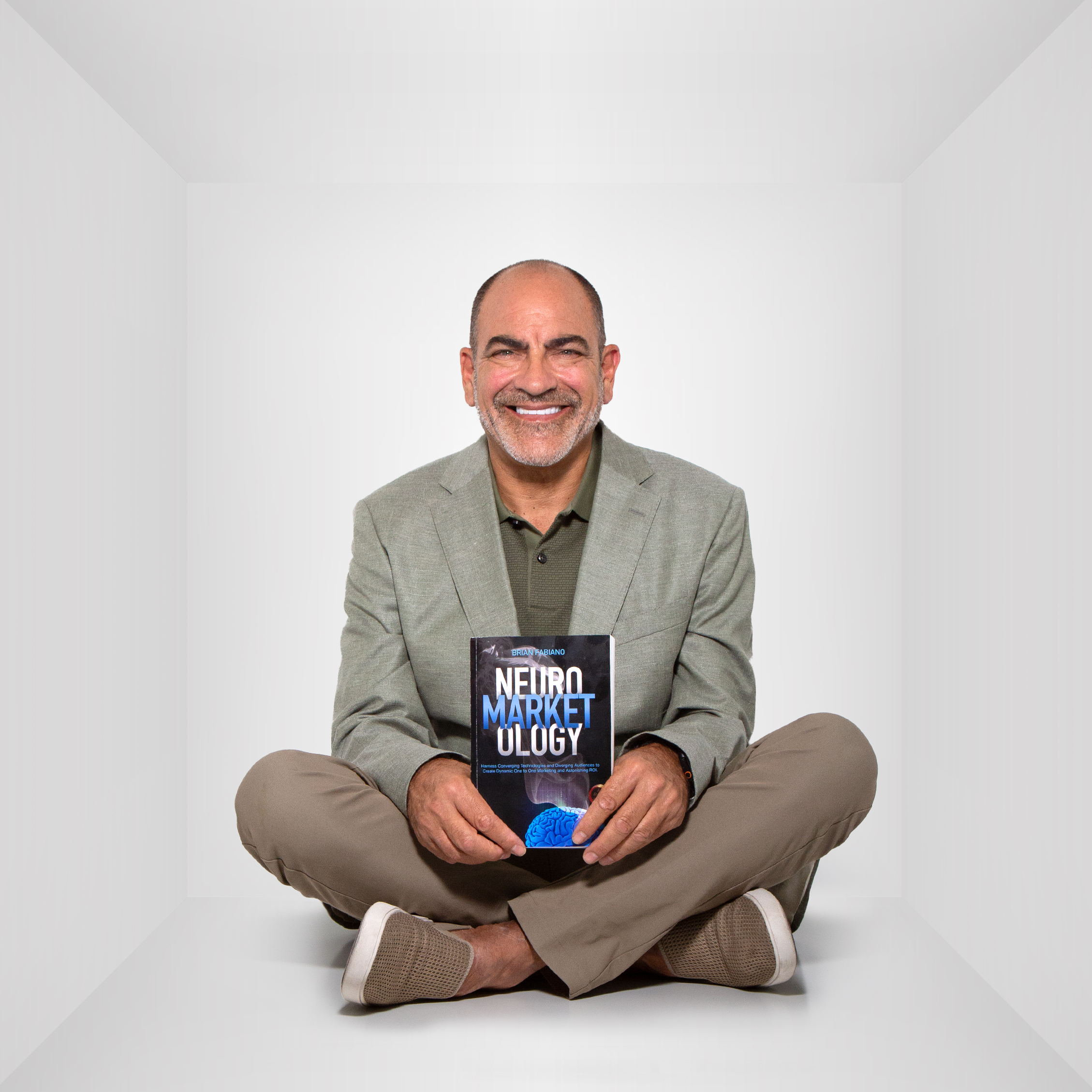 Brian holding his book NeuroMarketology