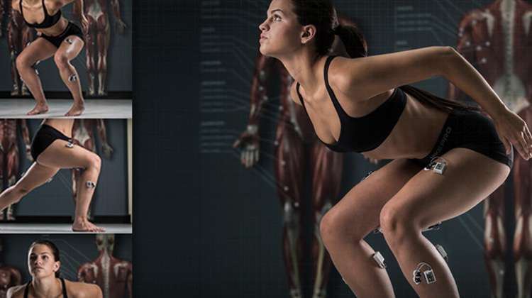 High-quality electromyography (EMG) product image of female model in black spandex workout clothing demonstrating the client body-worn biomechanical measurement sensor products.
