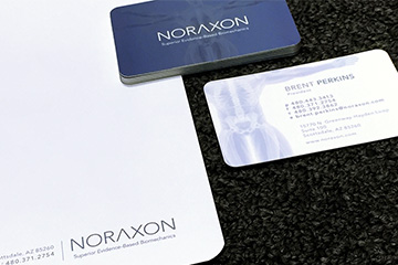 Images of biomechanics company Stationery created by FabCom featuring the company business card and the formal letterhead to demonstrate integrated branding.