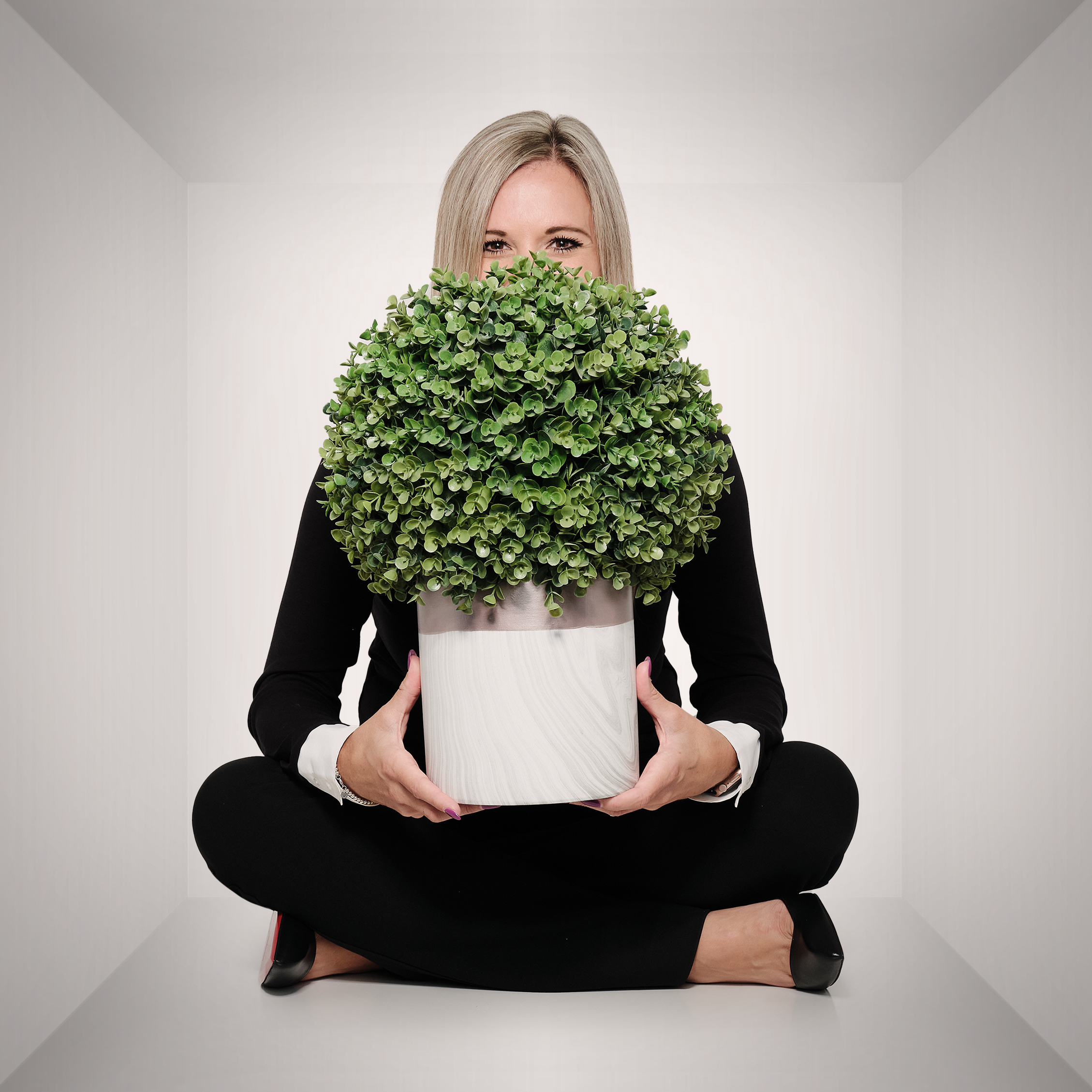 Brianna holding a plant