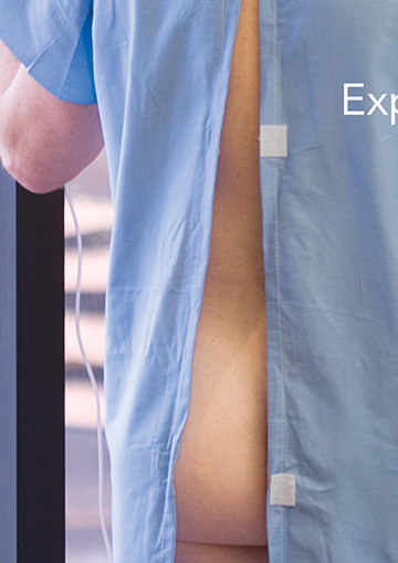 Close up image showing design detail of a print ad created by FabCom for a Contractor Management company featuring a man wearing an open hospital gown.