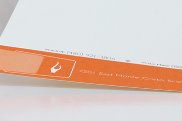 FabCom's stationery design for commercial printer featuring an illustrated lion jumping through a flaming hoop.