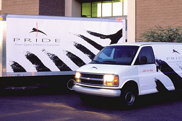 FabCom's vehicle graphics design for commercial printer featuring an illustrated lion jumping through a flaming hoop.