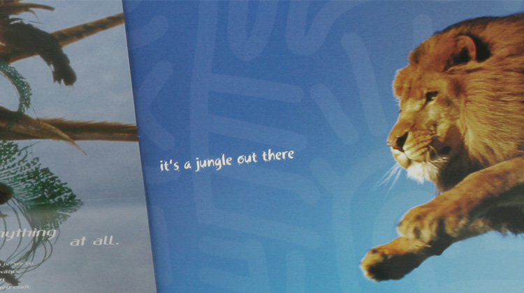 Zoomed in image of a page in the corporate brochure developed by FabCom for a commercial printer featuring the head of a soaring lion and the text 