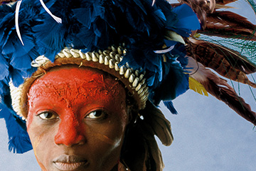 High-resolution zoomed in image showing design detail of a corporate brochure created by FabCom for a commercial printer featuring the face of an Indian tribe leader.