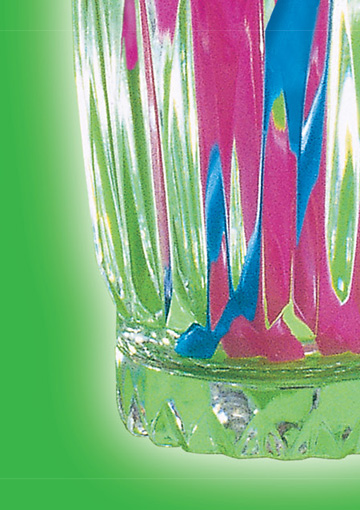 High-resolution zoomed-in image showing the intricate design detail and quality of a print ad FabCom designed. Image features the bottom of a glass cup containing pink and blue straws.