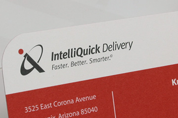 Close up image of a business card that FabCom developed as part of the corporate identify for a delivery solutions provider.