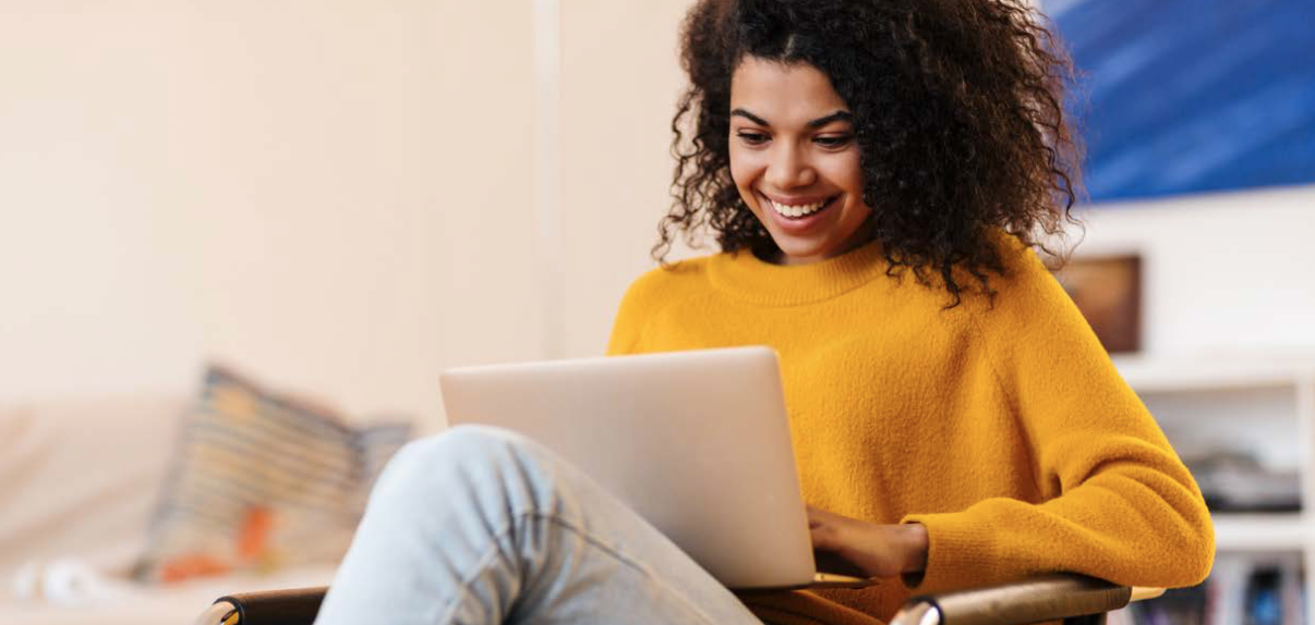 girl smiling on laptop