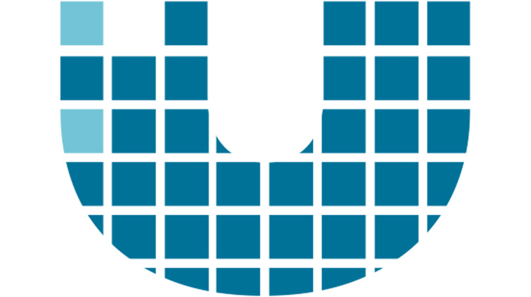High-resolution zoomed in image of a brand logo by FabCom, which has a U that is made of small blue boxes with white borders.