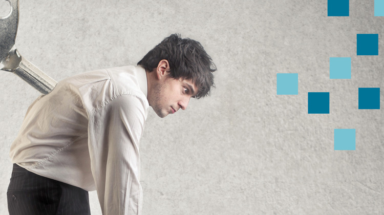 Zoomed in image by FabCom of a man slighlty hunched over with a turnkey in his back that was used in an advertising campaign for a healthcare IT company.
