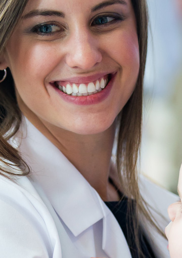 FabCom photographers took this photo of a beautiful smiling osteopathic medical school student.