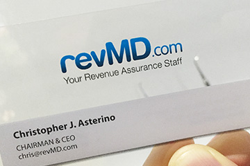 Close up image of revMD.com business card created by FabCom Integrated Strategic Marketing.