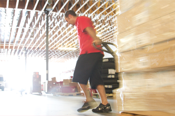 man pulling pallet