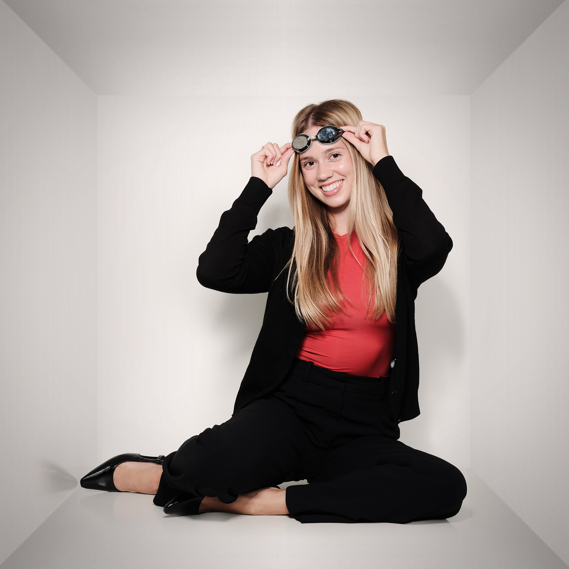 Katrina with her swimming cap and goggles on