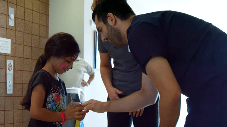 dentist giving child something