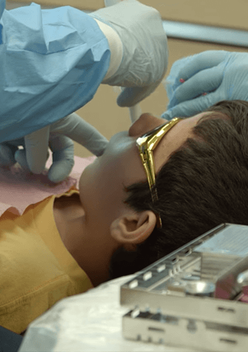 child getting dental work done