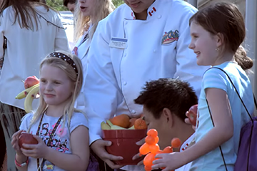 children with fruits smiling