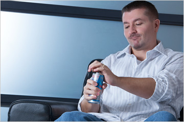 Image of FabCom’s Sr. Producer and Motion Director Lenny opening a can of Red Bull.