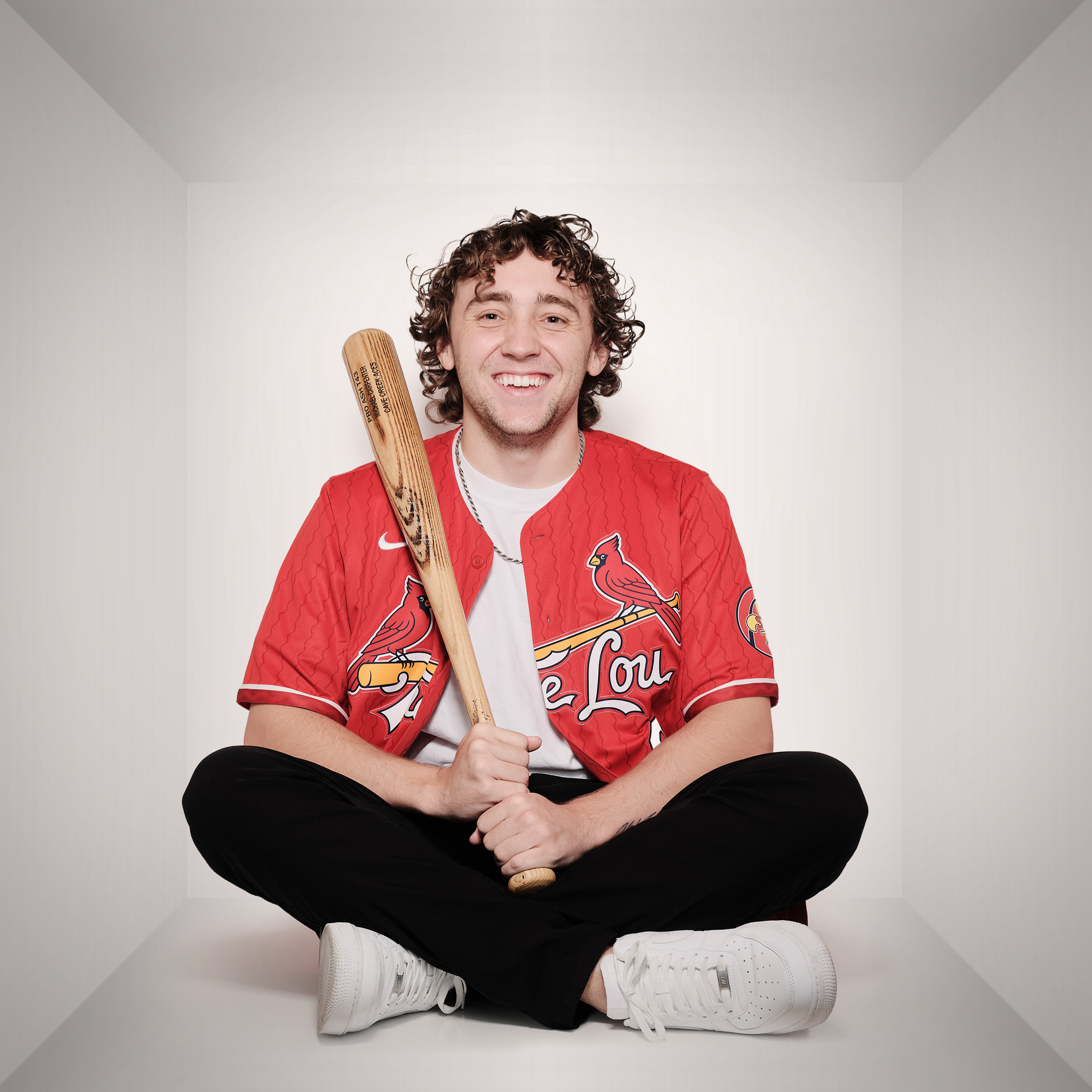 Michael holding a baseball bat