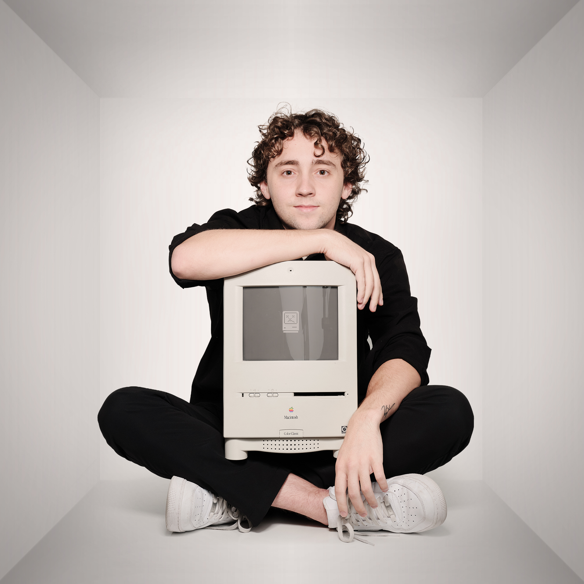 Michael sitting with the first mac