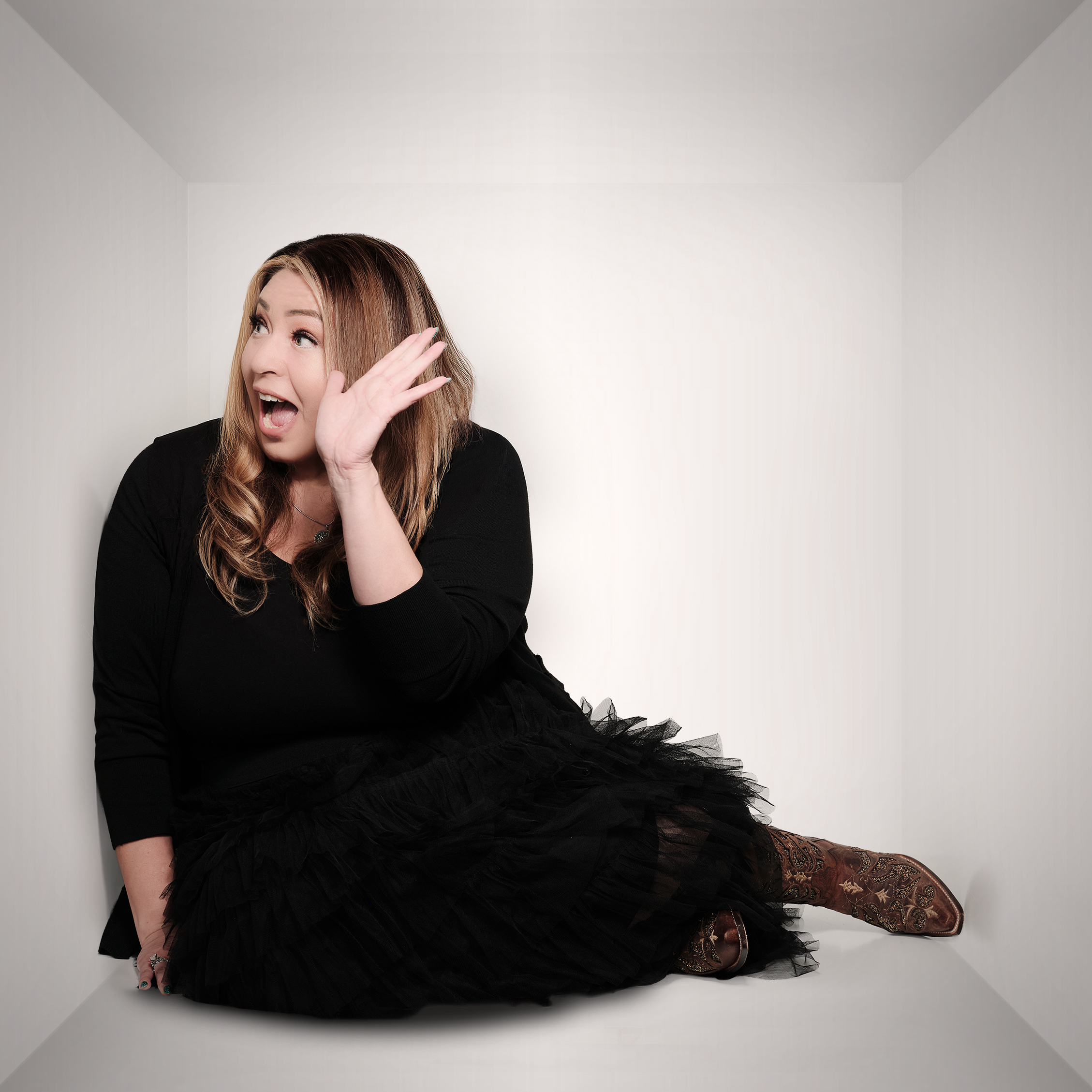 Monique listening towards the camera