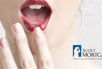 Zoomed-in image of a women with red lipstick holding her mouth open and having a hand in front of her chin that was used in a corporate identity created by FabCom.