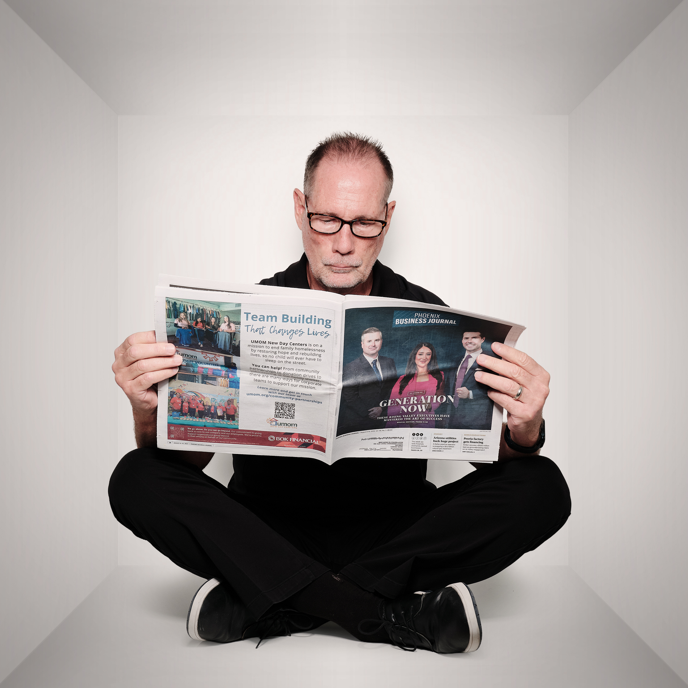 Mark reading a newspaper