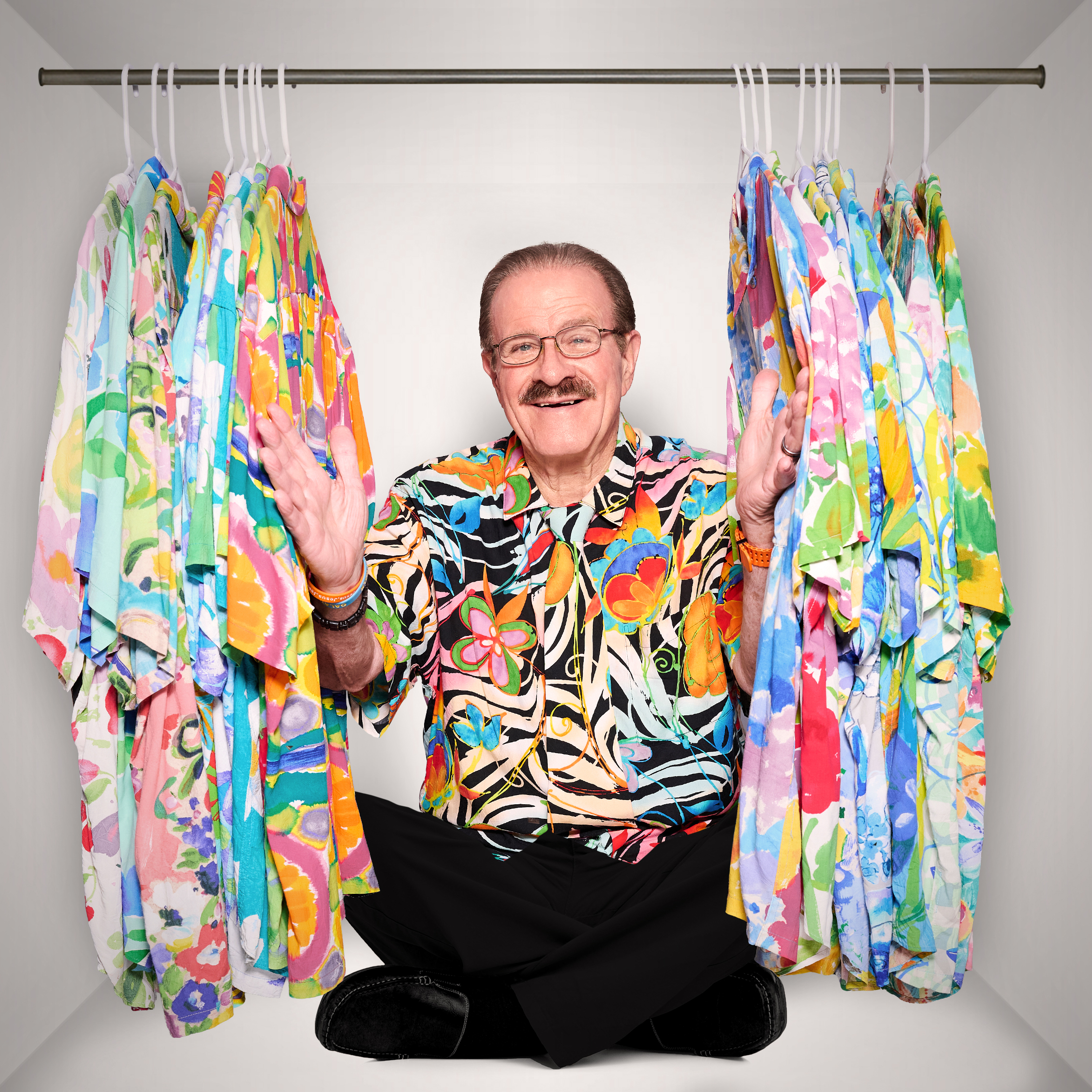 Paul hiding behind his Hawaii t shirts