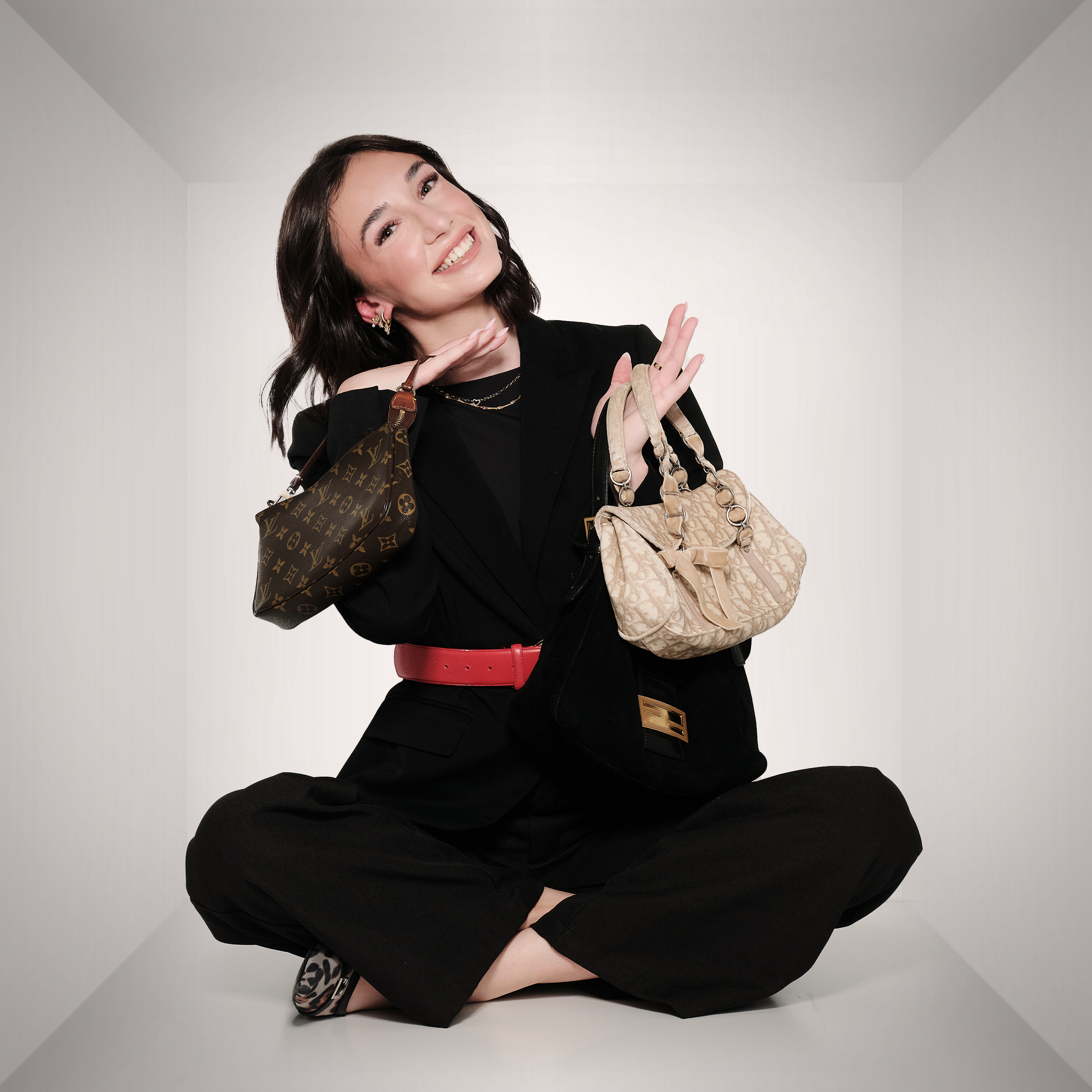 Reagan holding two purses