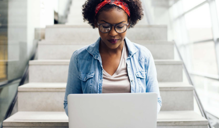 woman smiling on laptop