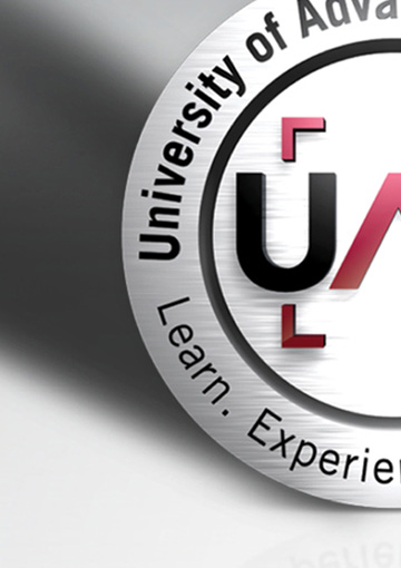 High-resolution zoomed in image of a technology university logo featured on a billboard created by FabCom.
