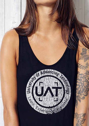 FabCom's t-shirt logo design for tech university women. The model has a full-sleeve tattoo to telegraph the client's support of unique student body culture.