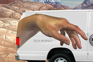 Close up image of large van with advertising wrap for the University of Advancing Technology driving on a road with a mountain backdrop to show creative detail.