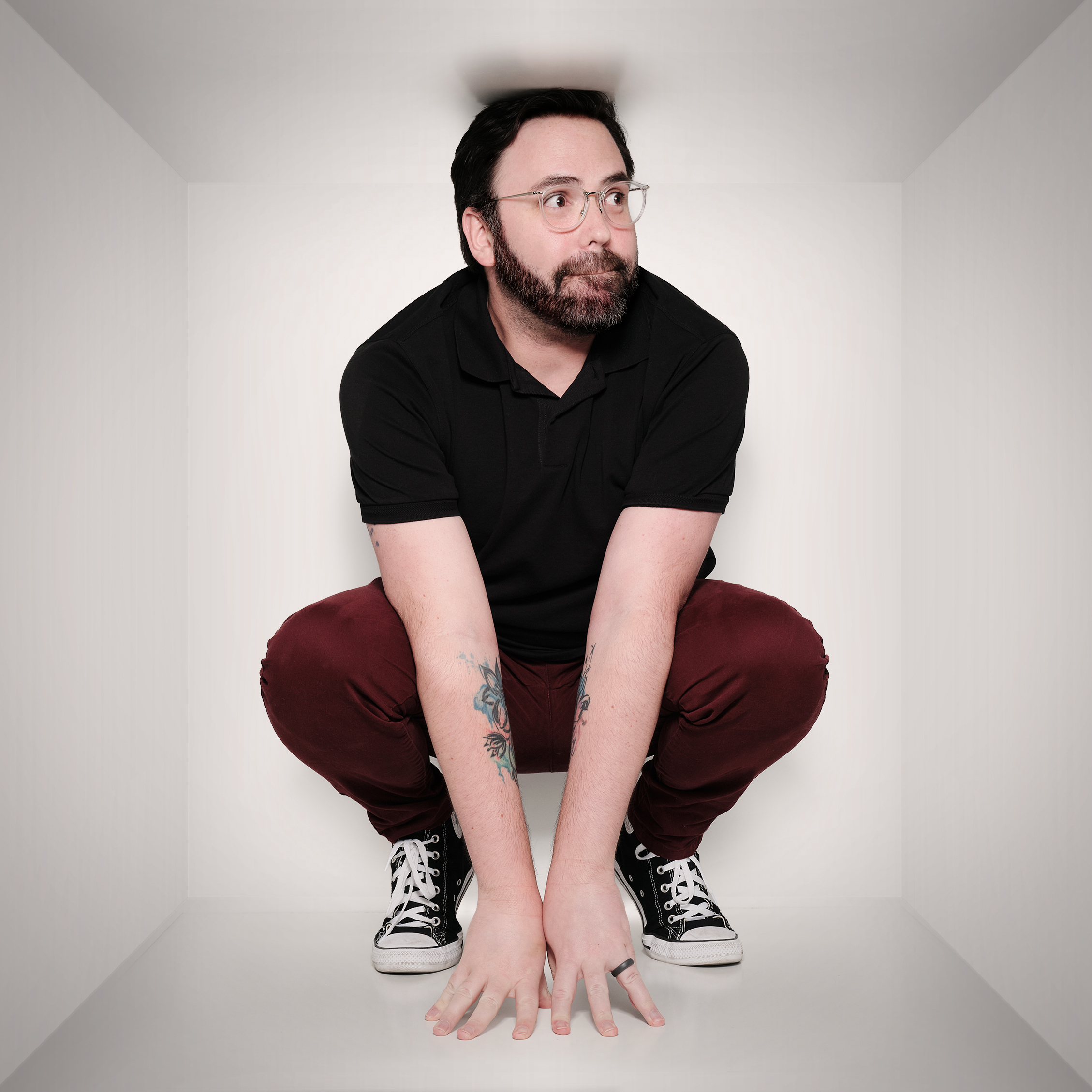 Trevor in a squatting pose