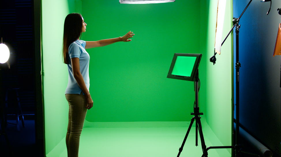 woman in front of green screen