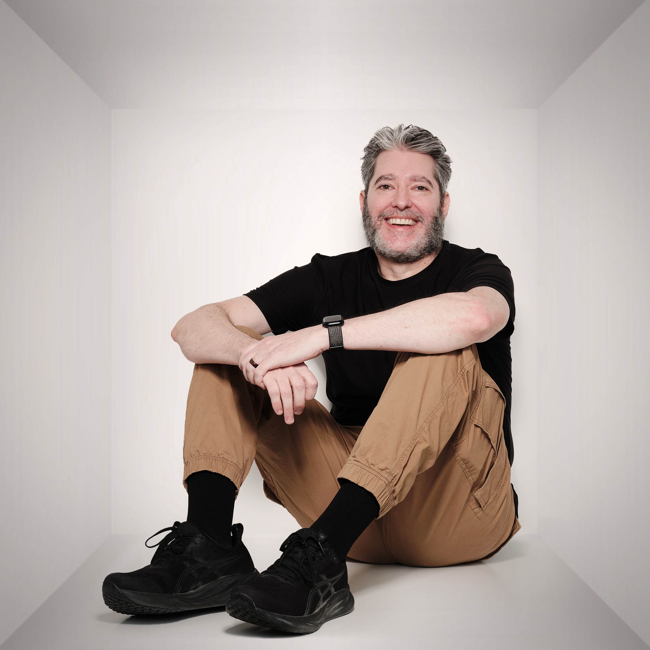 Yoni sitting down and smiling